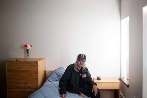 Joe Meyer, 62, sits in his new apartment at Huston Commons, Portland’s third “housing first” program for chronically homeless people. ““This is a life-changing type of thing,” he said.